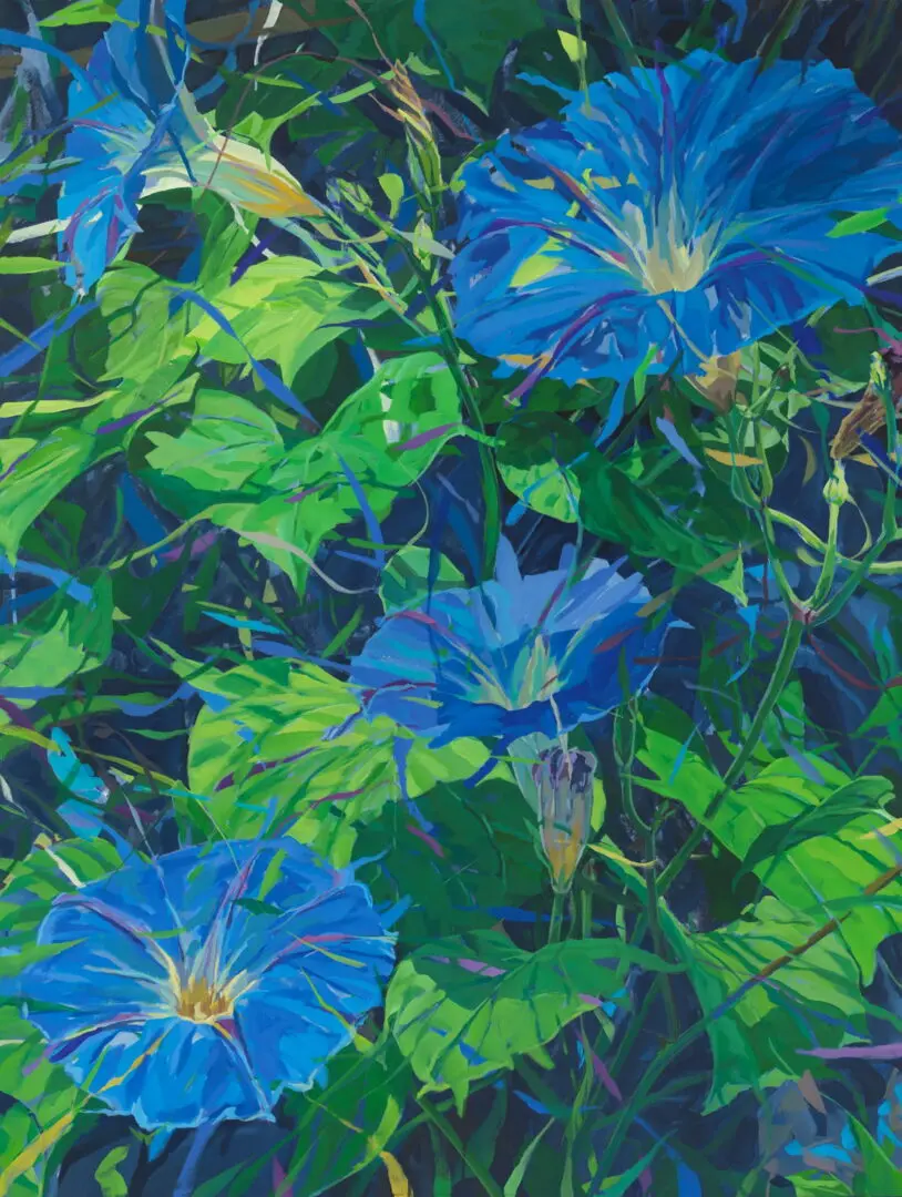 Vibrant blue flowers amidst lush green foliage.