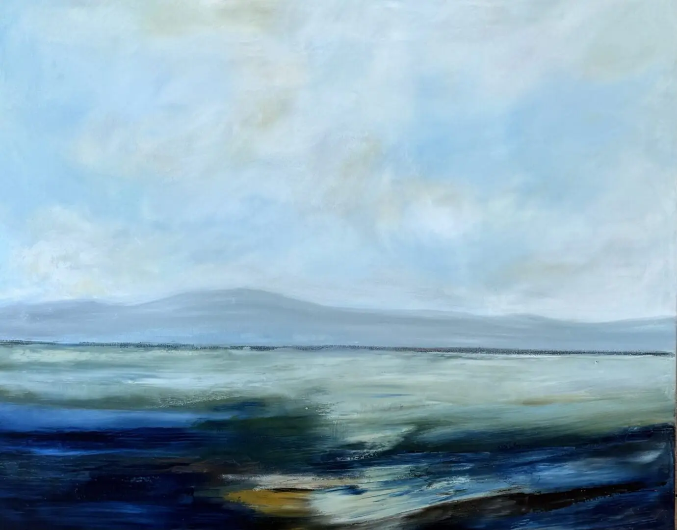 Serene seascape with soft blue hues.