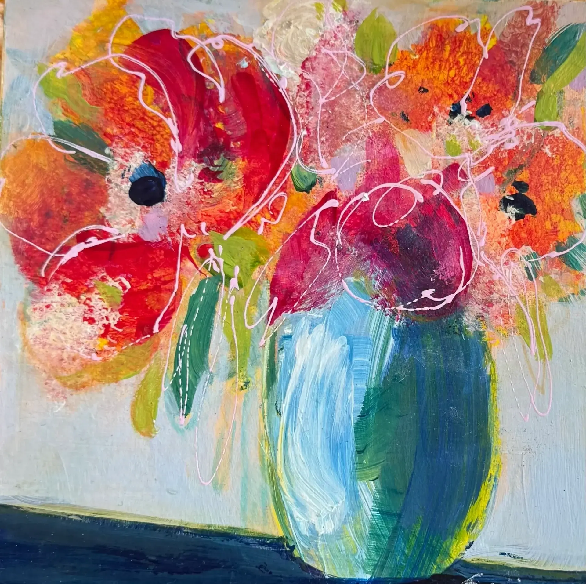 Colorful flowers in a blue vase painting.